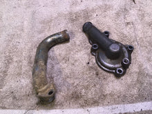 Load image into Gallery viewer, 2002 Yamaha WR250F Water pump cover coolant line