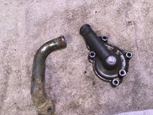 Load image into Gallery viewer, 2002 Yamaha WR250F Water pump cover coolant line