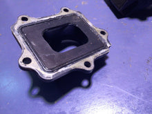 Load image into Gallery viewer, 2005 KAWASAKI KX250 2 STROKE V-FORCE  INTAKE REED BLOCK ASSEMBLY V FORCE 3