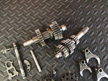 Load image into Gallery viewer, 1990 Kawasaki KX250 OEM Transmission Shaft Input Output Gears Gearbox Tranny