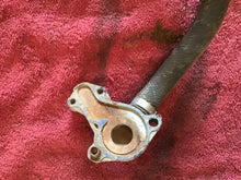Load image into Gallery viewer, 1986 Suzuki RM250 OEM Water Pump Cover Rad Hose
