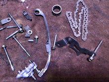 Load image into Gallery viewer, 2006 Honda CRF150F OEM misc engine hardware timing chain oil pump bolts guide
