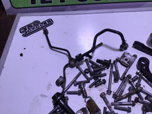 Load image into Gallery viewer, 2009 Kawasaki KLX250S KLX250 misc hardware chain guides oil line bolts clutch
