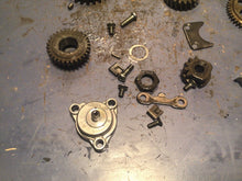 Load image into Gallery viewer, 1986 SUZUKI LT230S LT 230 S OIL PUMP ASSEMBLY HOUSING gear primary shift pawl
