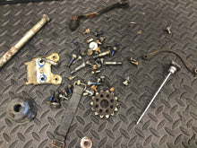 Load image into Gallery viewer, 1991 Suzuki DR350 DR 350 OEM misc chassis hardware bolts dipstick shifter bolt
