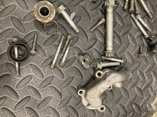 Load image into Gallery viewer, 2002-2025 Suzuki RM85 RM 85 85L misc hardware bolts water pump cover misc  OEM
